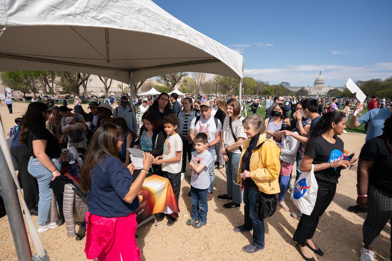 The NASA booth at the Eclipse Festival on the national mall during a partial solar eclipse in Washington, DC, Monday, April 8, 2024. A total solar eclipse swept across a narrow portion of the North American continent from Mexico’s Pacific coast to the Atlantic coast of Newfoundland, Canada. A partial solar eclipse was visible across the entire North American continent along with parts of Central America and Europe. Photo Credit: (NASA/Denny Henry)