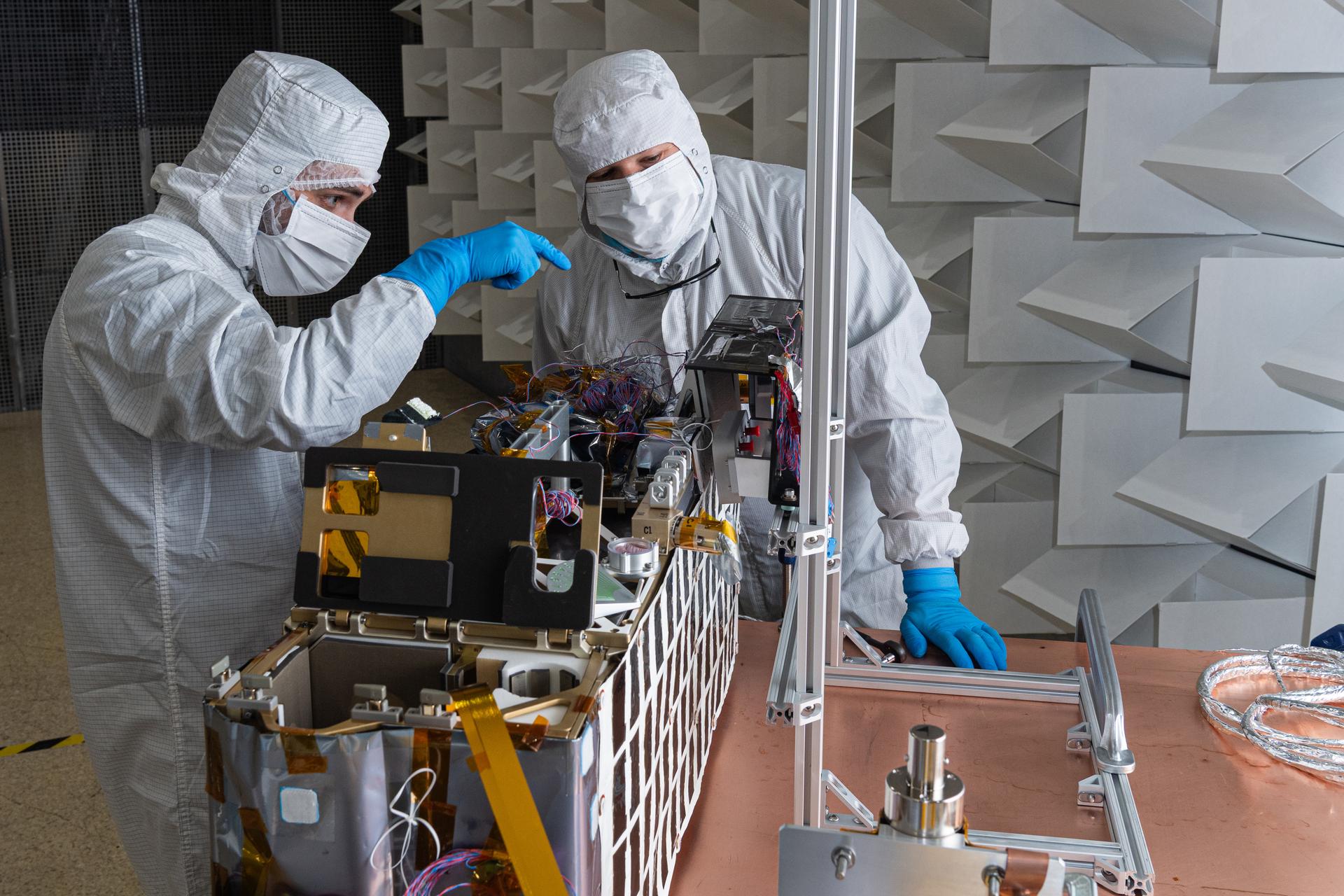 Mitchell Hamann and John Pindell configure the Lunar Environment Monitoring Station (LEMS) instrument for testing in the Electromagnetic Interference/Electromagnetic Compatibility (EMI/EMC) Chamber at Goddard Space Flight Center, Greenbelt Md., Feb 17, 2026. LEMS is a compact, autonomous, and self-sustaining seismometer suite designed to carry out continuous, long-term, monitoring of the lunar seismic environment at the South Polar region. Photo Credit: NASA/Mike Guinto