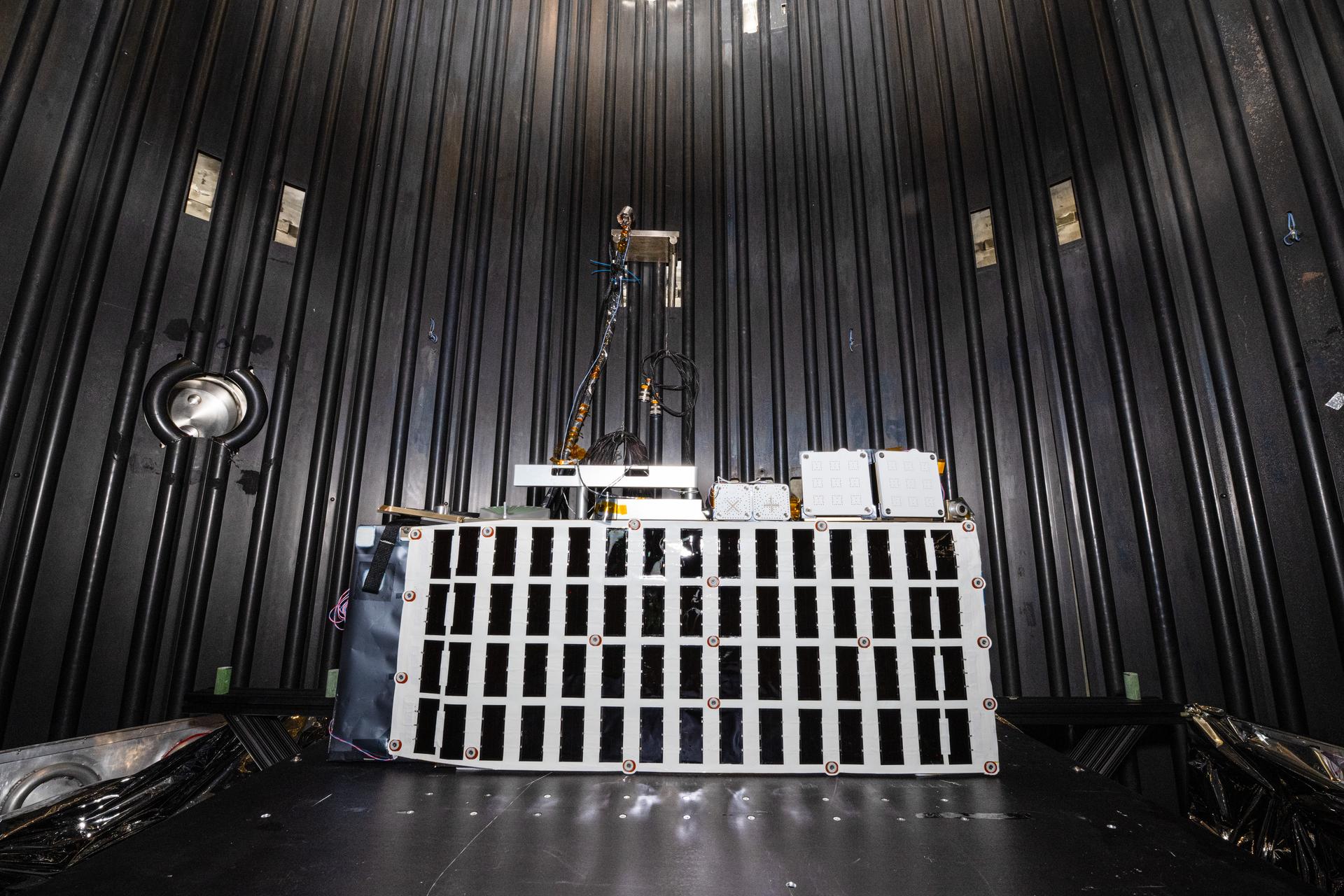 The Lunar Environment Monitoring Station (LEMS) instrument is installed for testing in a thermal vacuum chamber at Goddard Space Flight Center, Greenbelt Md., March 30, 2026. LEMS is a compact, autonomous, and self-sustaining seismometer suite designed to carry out continuous, long-term, monitoring of the lunar seismic environment at the South Polar region. Photo Credit: NASA/Denny Henry