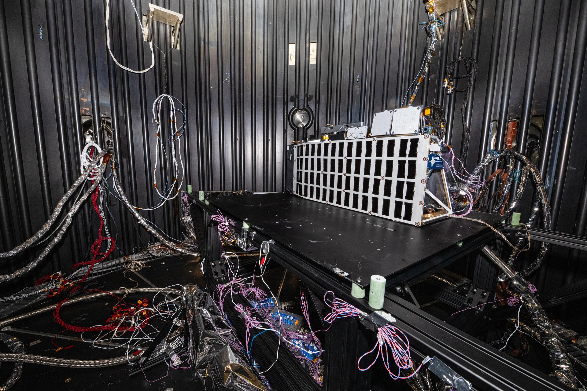 The Lunar Environment Monitoring Station (LEMS) instrument is installed for testing in a thermal vacuum chamber at Goddard Space Flight Center, Greenbelt Md., March 30, 2026. LEMS is a compact, autonomous, and self-sustaining seismometer suite designed to carry out continuous, long-term, monitoring of the lunar seismic environment at the South Polar region. Photo Credit: NASA/Denny Henry