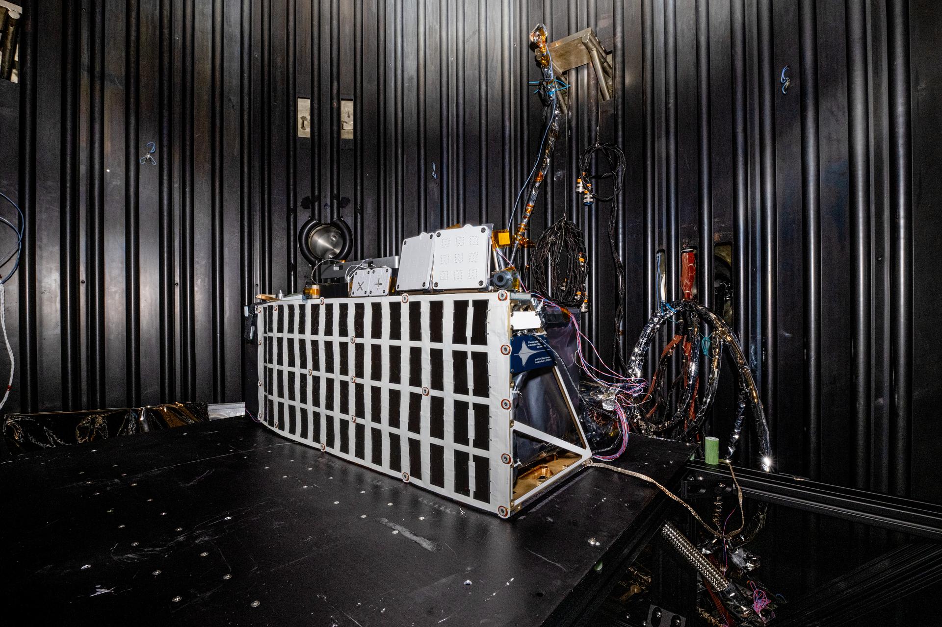 The Lunar Environment Monitoring Station (LEMS) instrument is installed for testing in a thermal vacuum chamber at Goddard Space Flight Center, Greenbelt Md., March 30, 2026. LEMS is a compact, autonomous, and self-sustaining seismometer suite designed to carry out continuous, long-term, monitoring of the lunar seismic environment at the South Polar region. Photo Credit: NASA/Denny Henry