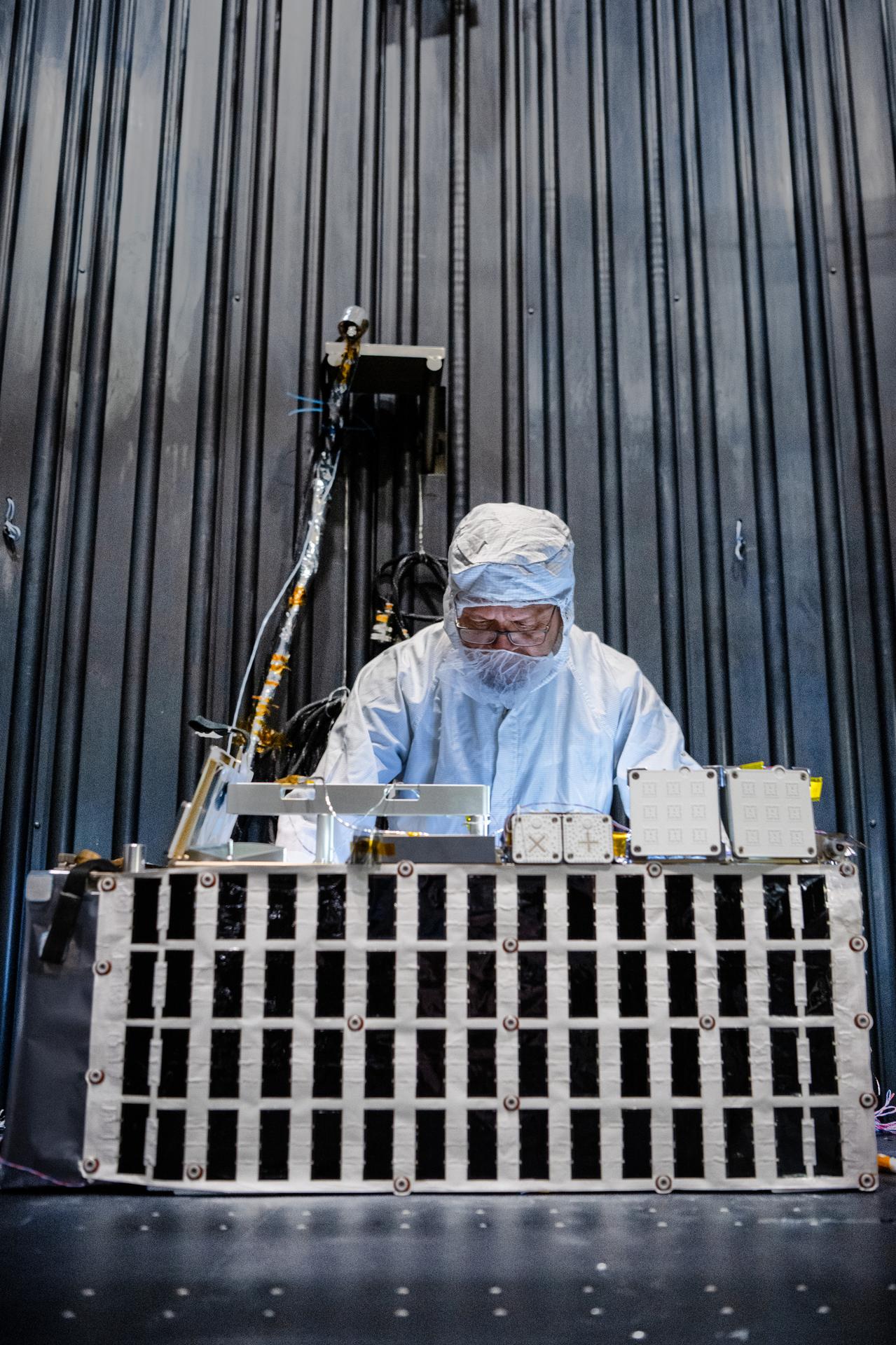 Engineering technician Jancilon Viegas installs thermocouples onto the The Lunar Environment Monitoring Station (LEMS) instrument in preparation for testing in a thermal vacuum chamber at Goddard Space Flight Center, Greenbelt Md., March 30, 2026. LEMS is a compact, autonomous, and self-sustaining seismometer suite designed to carry out continuous, long-term, monitoring of the lunar seismic environment at the South Polar region. Photo Credit: NASA/Denny Henry