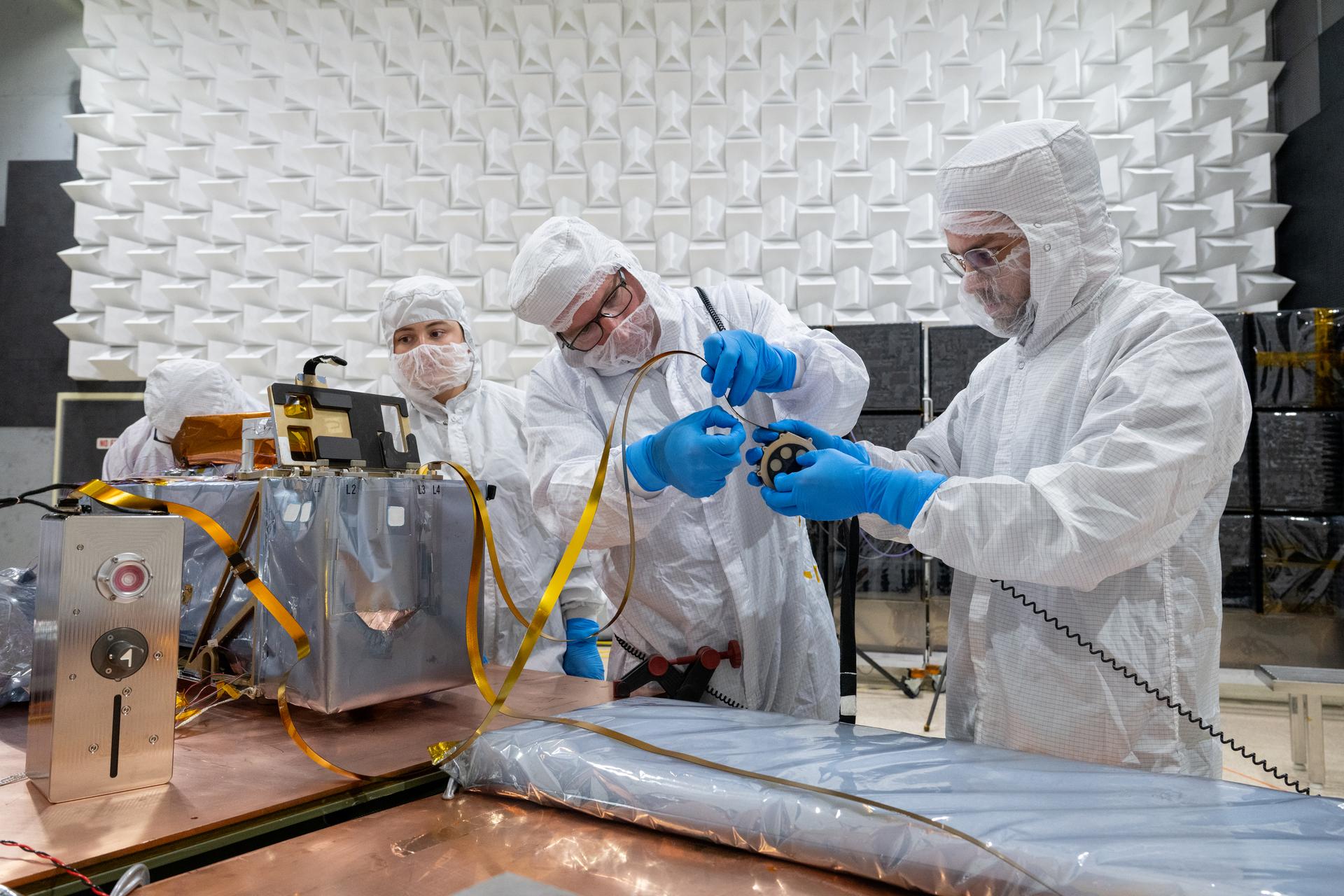 From left, mechanical engineer Brie Ludwig, technician Alex Schaeffer, and mechanical engineer Mitchell Hamann stow a seismometer after Electromagnetic Interference testing of the Lunar Environment Monitoring Station (LEMS) instrument at Goddard Space Flight Center, Greenbelt Md., May 15, 2026. LEMS is a compact, autonomous, and self-sustaining seismometer suite designed to carry out continuous, long-term, monitoring of the lunar seismic environment at the South Polar region. Photo Credit: NASA/Desiree Stover