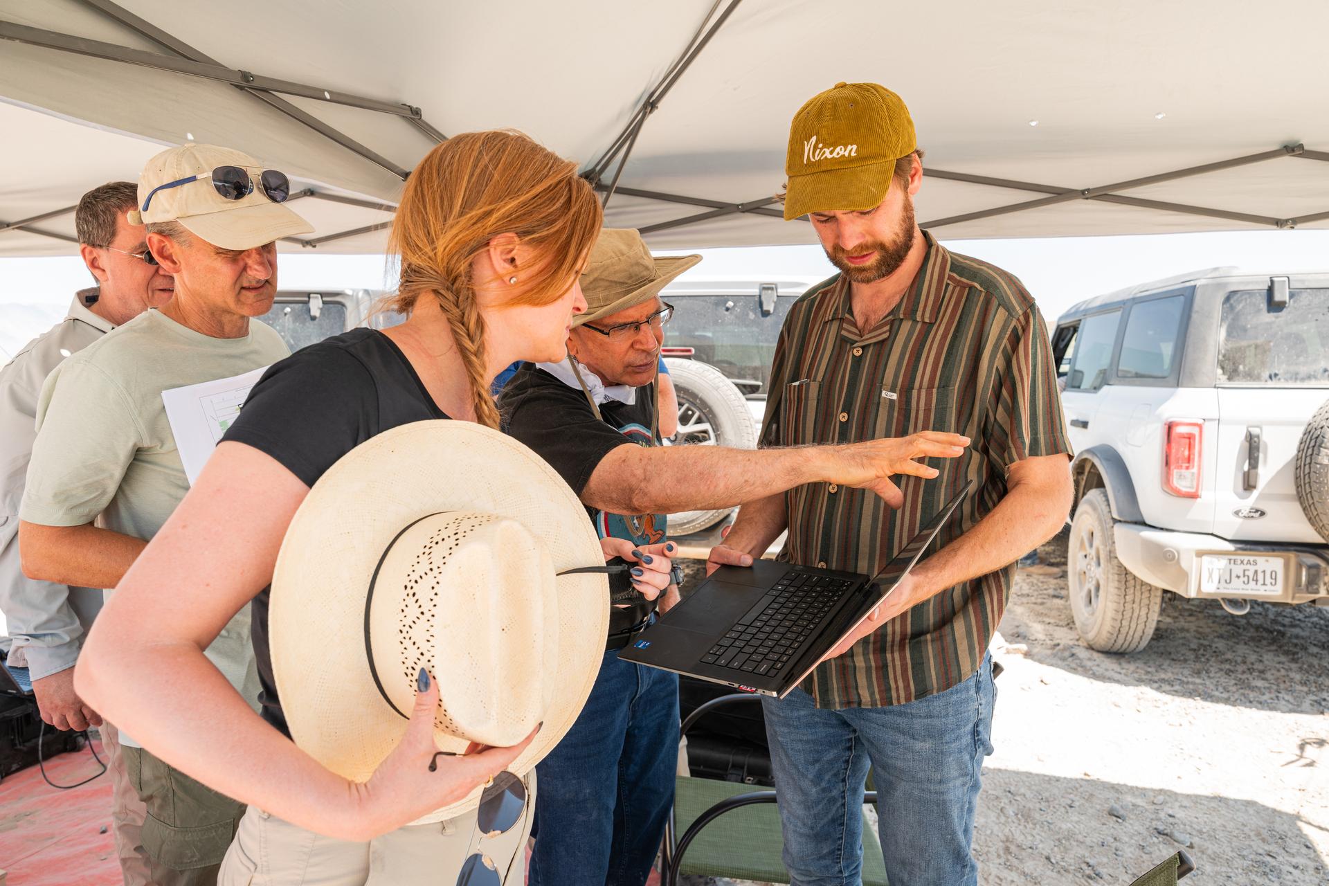 Pictured are DAVINCI’s (left to right) Mike Ravine, Brent Bos, Erika Kohler, Jim Garvin, and Christian Tate, evaluating flight data in real-time to adapt their future tests to the lessons learned from each flight. The researchers are standing in an area of Crater Island, Utah, which was the site of a series of tests (June 23-25, 2026) of the camera system that will one day fly aboard NASA’s DAVINCI mission probe to Venus. NASA/Mike Guinto