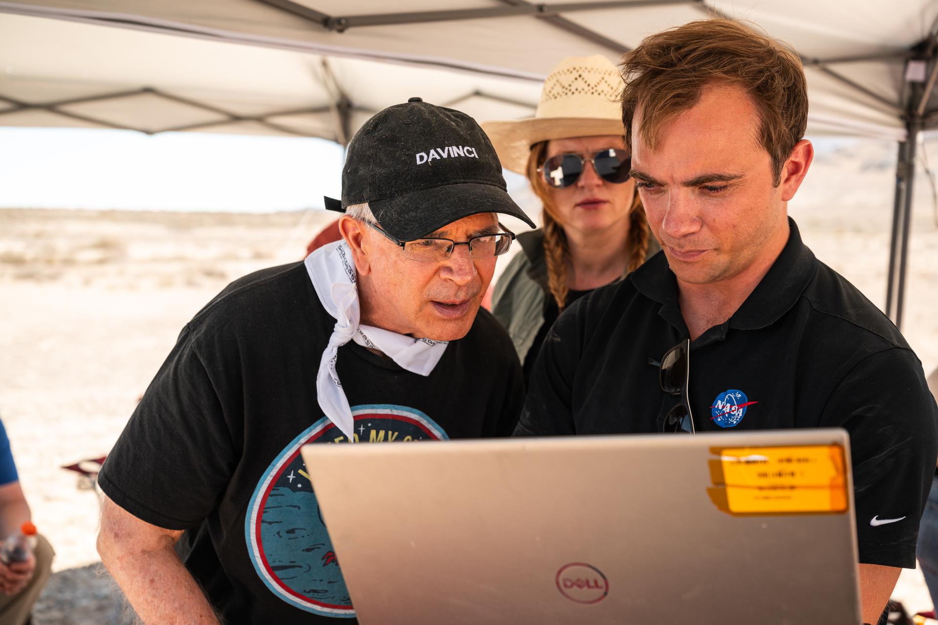 Pictured are DAVINCI’s (left to right) Jim Garvin, mission principal investigator; Erika Kohler, acting deputy principal investigator; and Matthew Mullin, space laser engineer, evaluating flight data in real-time to adapt their future tests to the lessons learned from each flight. The researchers are standing in an area of Crater Island, Utah, which was the site of a series of tests (June 23-25, 2026) of the camera system that will one day fly aboard NASA’s DAVINCI mission probe to Venus.