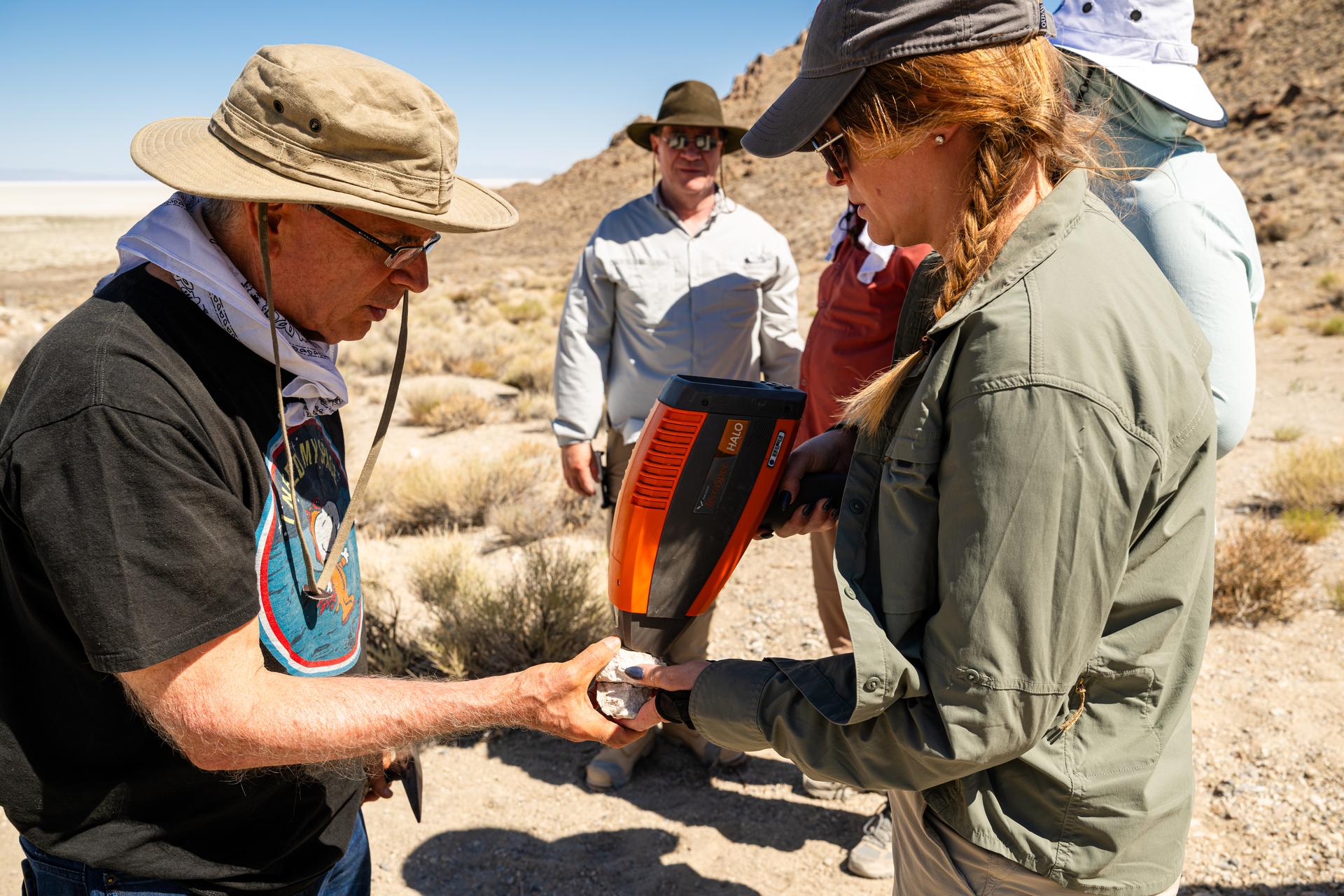 Dr. Jim Garvin, mission principal investigator, left, and Dr. Erika Kohler, acting deputy principal investigator, right, take measurements of rock samples found at Crater Island, Utah on June 23, 2026. These samples become the "ground truth" for the measurements from the VADIX prototype camera system which flew over the crater island site, taking photos and measurements from the air. NASA/Mike Guinto