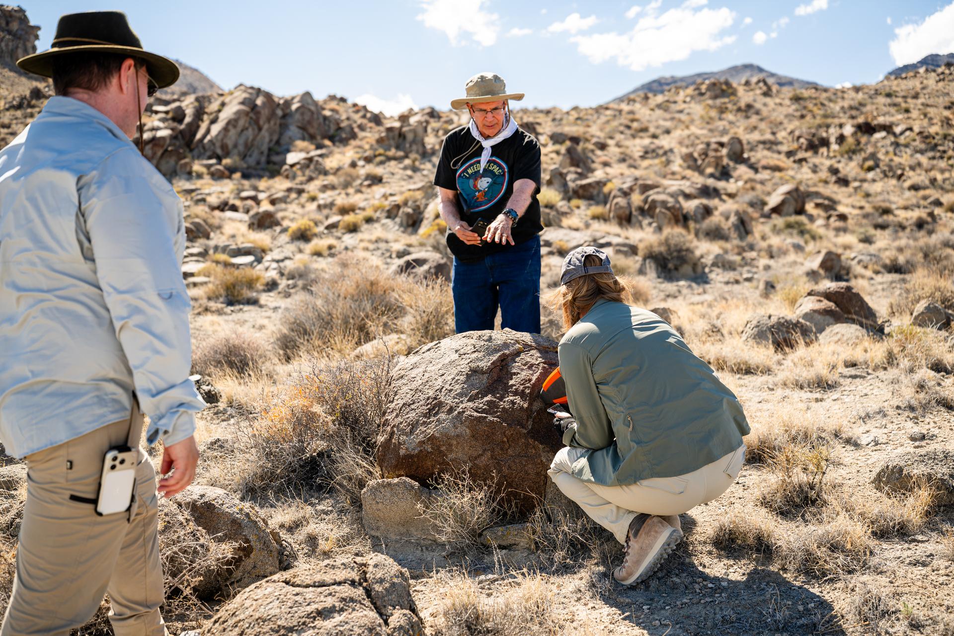 Mike Ravine, left, Jim Garvin, and Erika Kohler, take direct measurements of rocks observed at Crater Island, Utah as part of the DAVINCI VADIX experiment, June 23, 2026. NASA/Mike Guinto