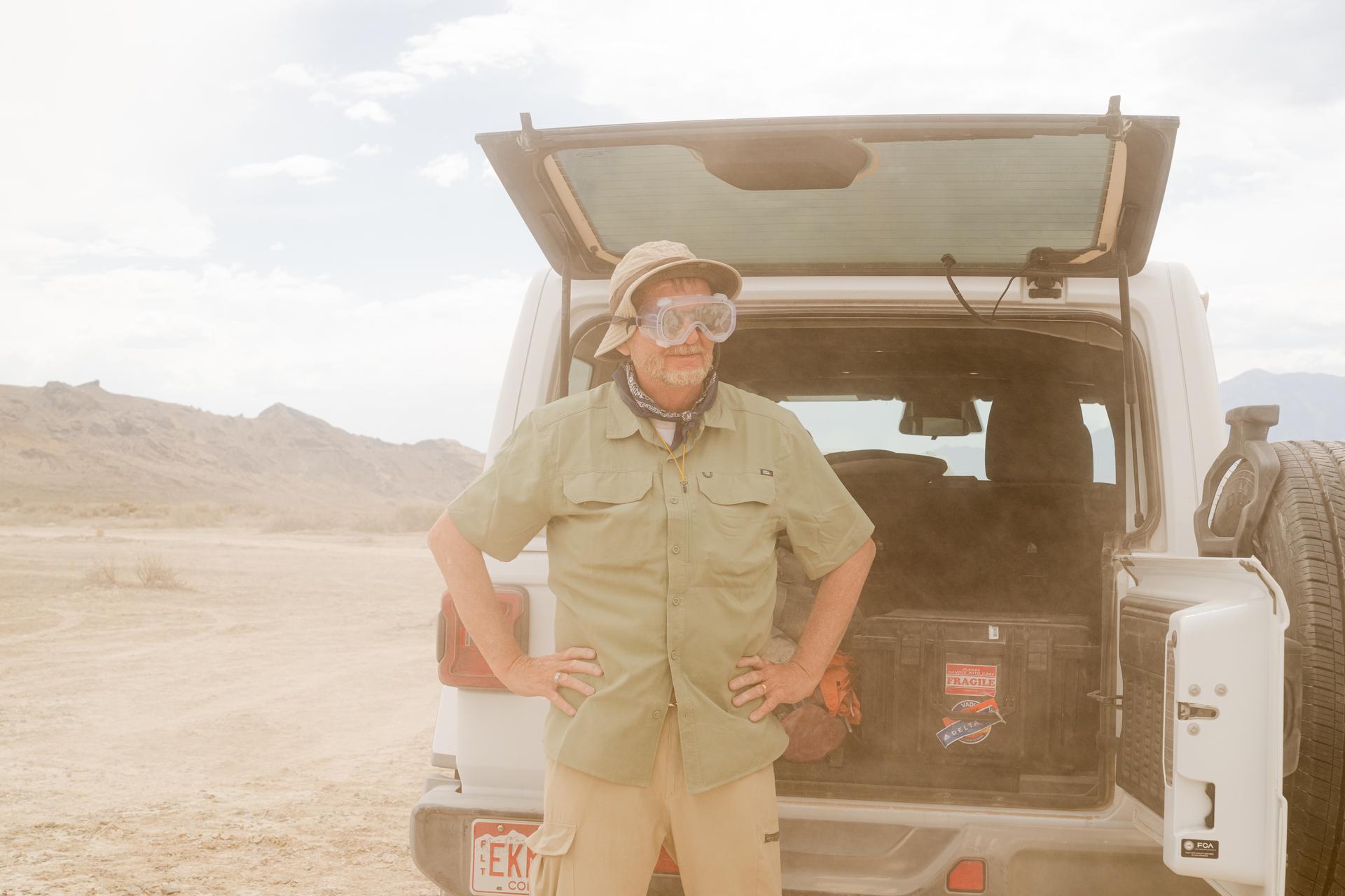 Bob Podgurski wears goggles during a dust event at the DAVINCI VADIX basecamp, Crater Island, Utah, June 24, 2026. This area was the site of a series of tests (June 23-25, 2026) of the camera system that will one day fly aboard NASA’s DAVINCI mission to Venus. NASA/Mike Guinto