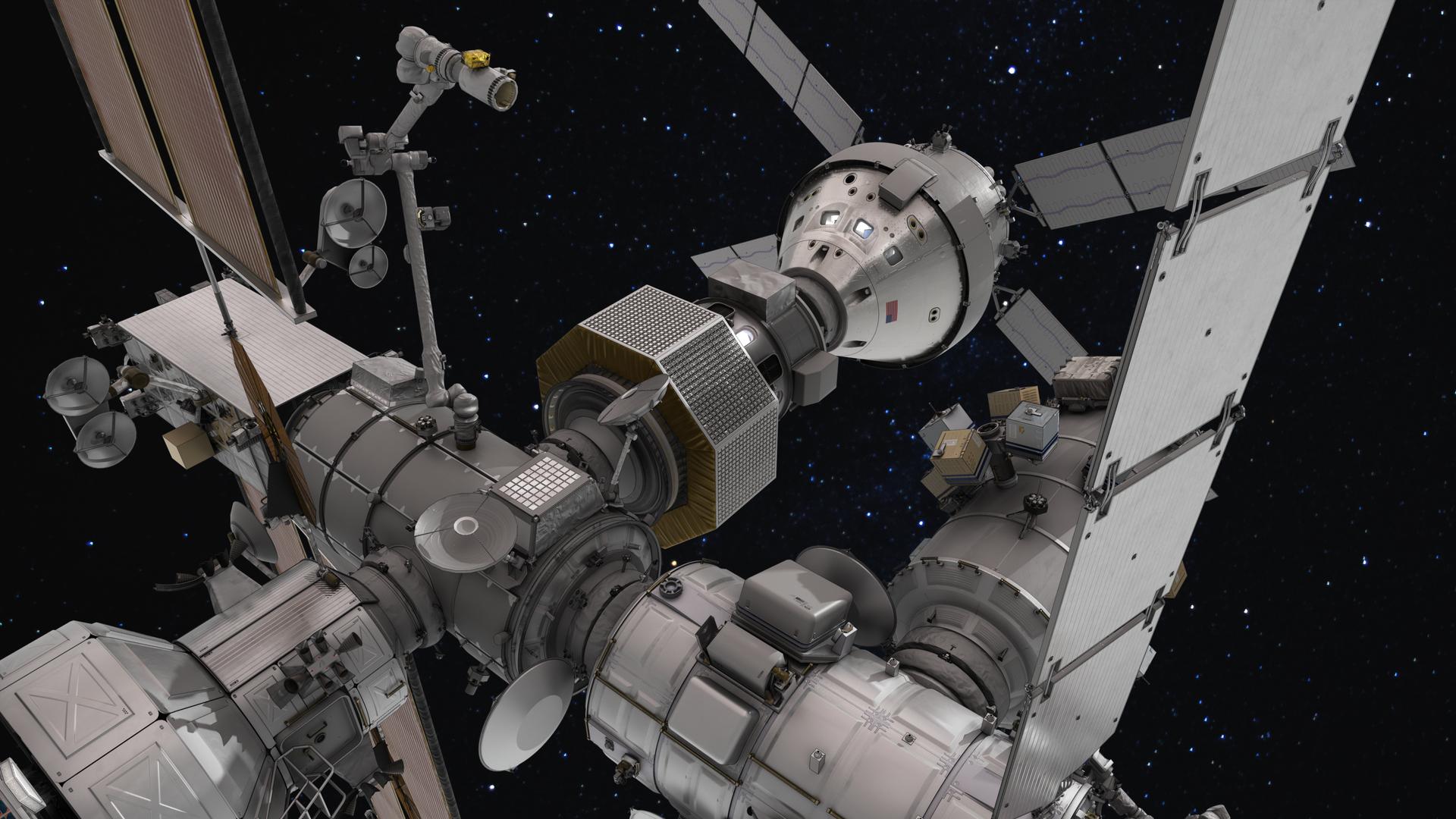 An artist’s rendering provides a detailed view of NASA’s Gateway space station, featuring various interconnected modules and solar panels. Numerous antennas and instruments are visible, all set against the backdrop of a starry outer space. Image Credit: NASA.