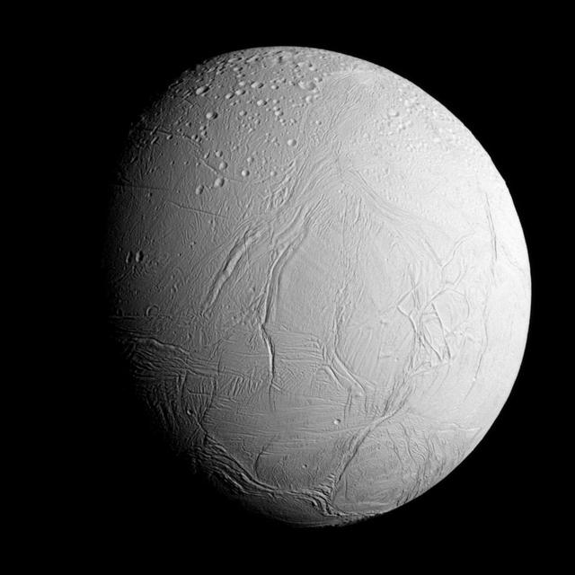 NASA's Cassini spacecraft captured this view as it neared icy Enceladus for its closest-ever dive past the moon's active south polar region. The view shows heavily cratered northern latitudes at top, transitioning to fractured, wrinkled terrain in the middle and southern latitudes. The wavy boundary of the moon's active south polar region -- Cassini's destination for this flyby -- is visible at bottom, where it disappears into wintry darkness. This view looks towards the Saturn-facing side of Enceladus. North on Enceladus is up and rotated 23 degrees to the right. The image was taken in visible light with the Cassini spacecraft narrow-angle camera on Oct. 28, 2015. The view was acquired at a distance of approximately 60,000 miles (96,000 kilometers) from Enceladus and at a Sun-Enceladus-spacecraft, or phase, angle of 45 degrees. Image scale is 1,896 feet (578 meters) per pixel. The Cassini mission is a cooperative project of NASA, ESA (the European Space Agency) and the Italian Space Agency. The Jet Propulsion Laboratory, a division of the California Institute of Technology in Pasadena, manages the mission for NASA's Science Mission Directorate, Washington. The Cassini orbiter and its two onboard cameras were designed, developed and assembled at JPL. The imaging operations center is based at the Space Science Institute in Boulder, Colorado. For more information about the Cassini-Huygens mission visit http://saturn.jpl.nasa.gov and http://www.nasa.gov/cassini. The Cassini imaging team homepage is at http://ciclops.org.