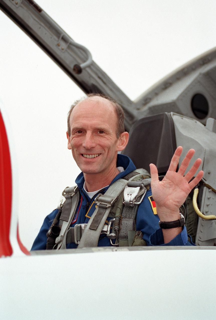 JSC2000-00921 (27 January 2000) --- Astronaut Gerhard P.J. Thiele, mission specialist representing the European Space Agency (ESA), waves at colleagues  from a T-38 jet trainer prior to departure from Ellington Field en route to Florida.  Thiele, along with four American astronauts and one representing Japan's National Space Development Agency (NASDA), are scheduled  for launch aboard the Space Shuttle Endeavour in a little less than a week.