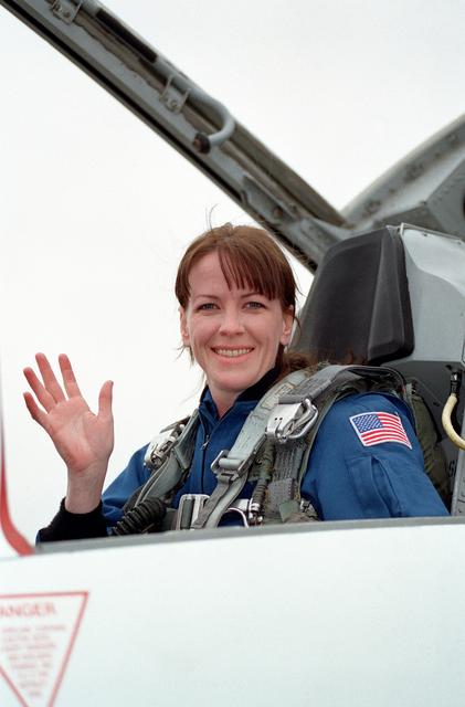 NASA image: STS-99 crewmembers in aircraft prior to leaving Ellington Field for KSC