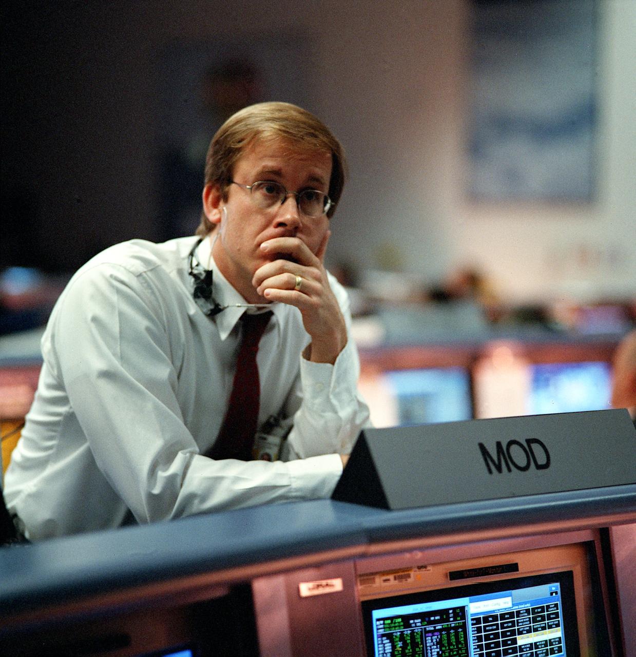JSC2000-01065 (31 January 2000) --- Flight Director John Shannon, with his back to the FD console, waits patiently for the &quot;go&quot; or &quot;no go&quot; decision from the Kennedy Space Center (KSC).  This attempt of the STS-99 Endeavour launch  was eventually scrubbed, and managers quickly huddled to decide options for the next opportunity.