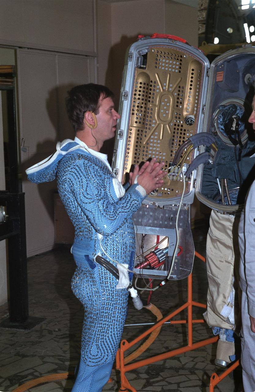 JSC2000-05366 (7 June 2000) --- Cosmonaut Yuri Gidzenko, Soyuz commander for the Expedition One crew, wearing thermal undergarment, is about to don an Orlan space suit.  Gidzenko was preparing to participate in an underwater simulation in the Hydrolab facility at the Gagarin Cosmonaut Training Center in Russia.  Gidzenko was joined by astronaut William Shepherd, mission commander, in the underwater session.