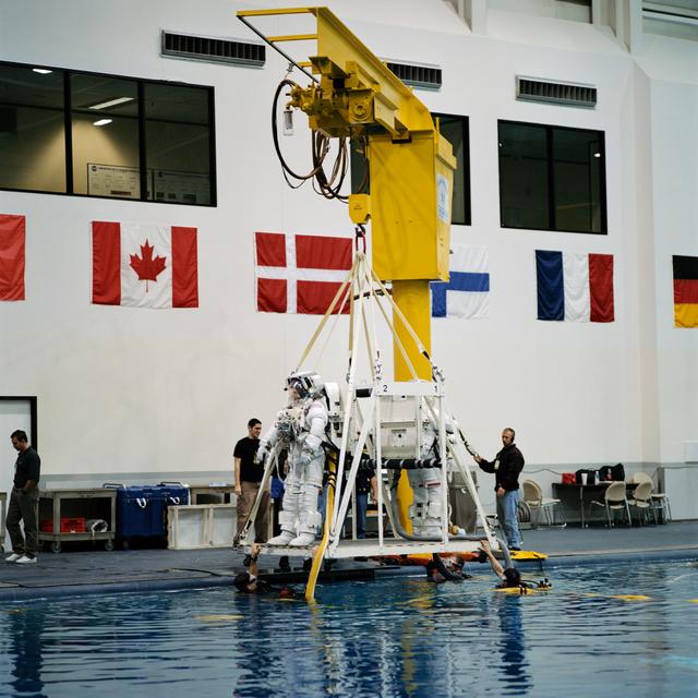 NASA image: STS-100 crewmembers prepare to train in NBL