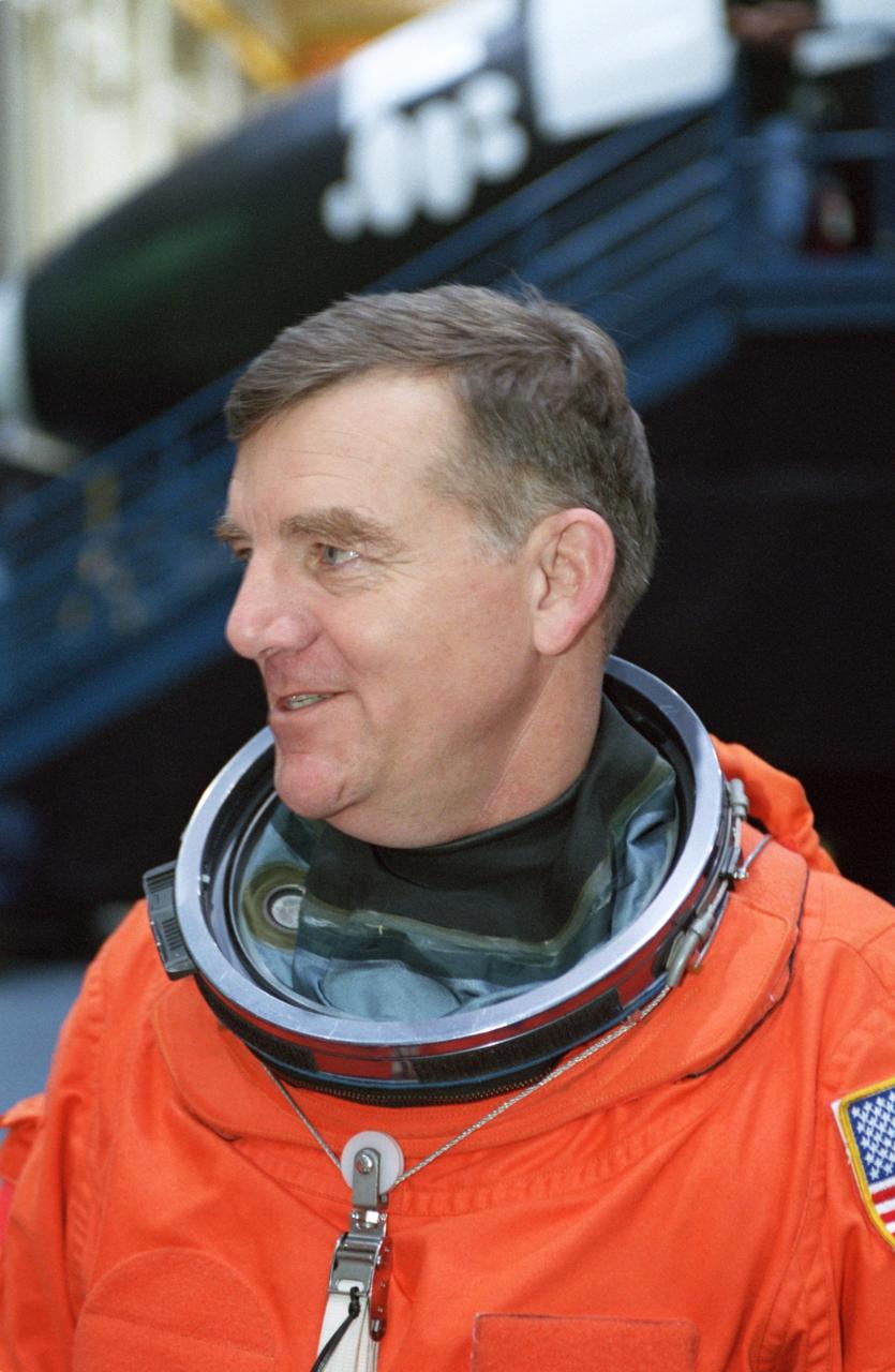 JSC2000-07444 (6 December 2000)  --- Astronaut James S. Voss, Expedition Two crew member in training for next year's second lengthy stay aboard the International Space Station (ISS),  listens as crew training personnel (out of frame) explain procedures for an upcoming simulation.  The training took place in the  crew compartment trainer (CCT-2) in the high bay area of the Johnson Space Center's Systems Integration Facility.