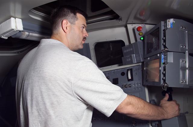 NASA image: Views of STS-106 Pilot Scott Altman training with the RMS arm
