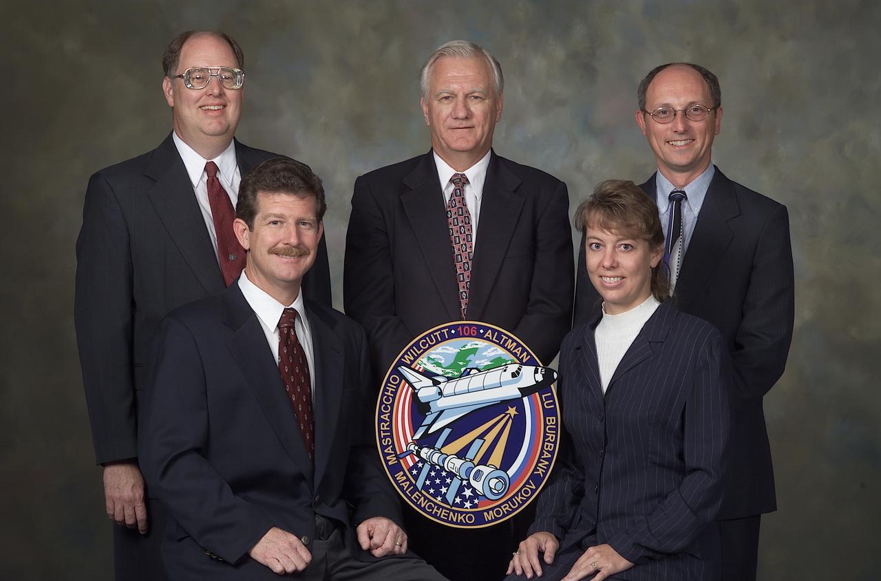 JSC2000-E-19040 (July 2000) --- These flight directors have been named for key support to the STS-106 mission, scheduled for September of this year. In front are Phil Engelauf, Orbit 1 and lead; Kelly Beck, planning.  Standing, from the left, are Wayne Hale, ascent and entry; Bill Reeves, Team 4; and Paul Dye, Orbit 2. Team 4 will periodically fill in for other flight controllers, allowing some shifting of teams to other times of the day.