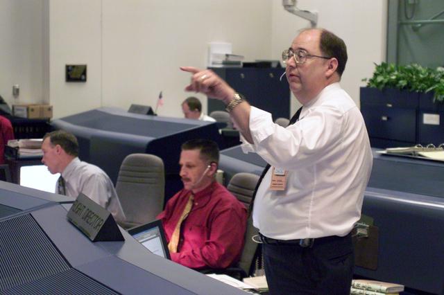 JSC2000-E-22287 (8 September 2000) ---  Flight controllers in Houston await the launch of the Space Shuttle Atlantis from the Kennedy Space Center (KSC) in Florida. From the left are astronauts Dominic L. Gorie and Christopher J. Loria, both at the Spacecraft Communicator (CAPCOM) console; and Wayne Hale at the Flight Director console. The Space Shuttle later launched on schedule, at 8:46 a.m. (EDT), September 8, 2000, as the Johnson Space Center (JSC) flight control team took the baton from KSC's launch controllers.