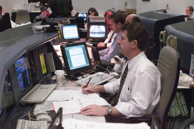 NASA image: Various views of personnel in MCC during STS-106
