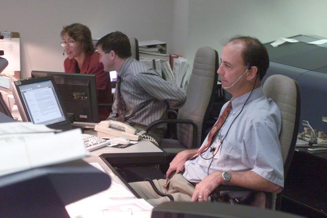 NASA image: Various views of personnel in MCC during STS-106