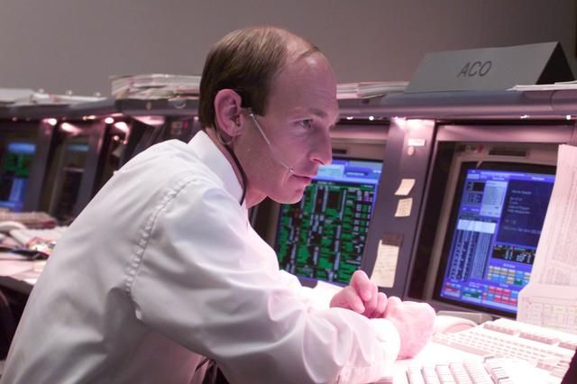 NASA image: Personnel in blue and white FCR bldg 30 during STS-106