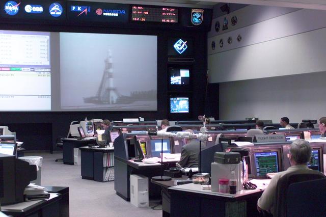 JSC2000-E-27301 (31 October 2000) ---  Flight controllers in Houston's Mission Control Center follow the countdown to  the Kazakhstan liftoff of the Soyuz, carrying the Expedition One crew.