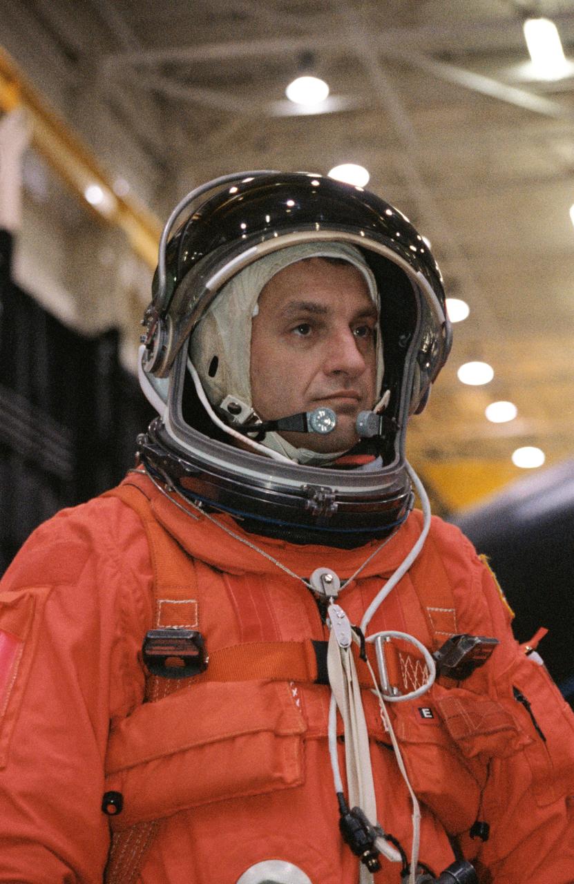 JSC2001-02197 (9 August 2001) --- Suited in a training version of the full-pressure launch and entry suit, astronaut Richard M. Linnehan, STS-109 mission specialist, awaits a training session in one of the trainer/mockups (out of frame) in the Space Vehicle Mockup Facility at the Johnson Space Center (JSC). STS-109 will be the 108th shuttle flight and the fourth Hubble Space Telescope (HST) servicing mission.