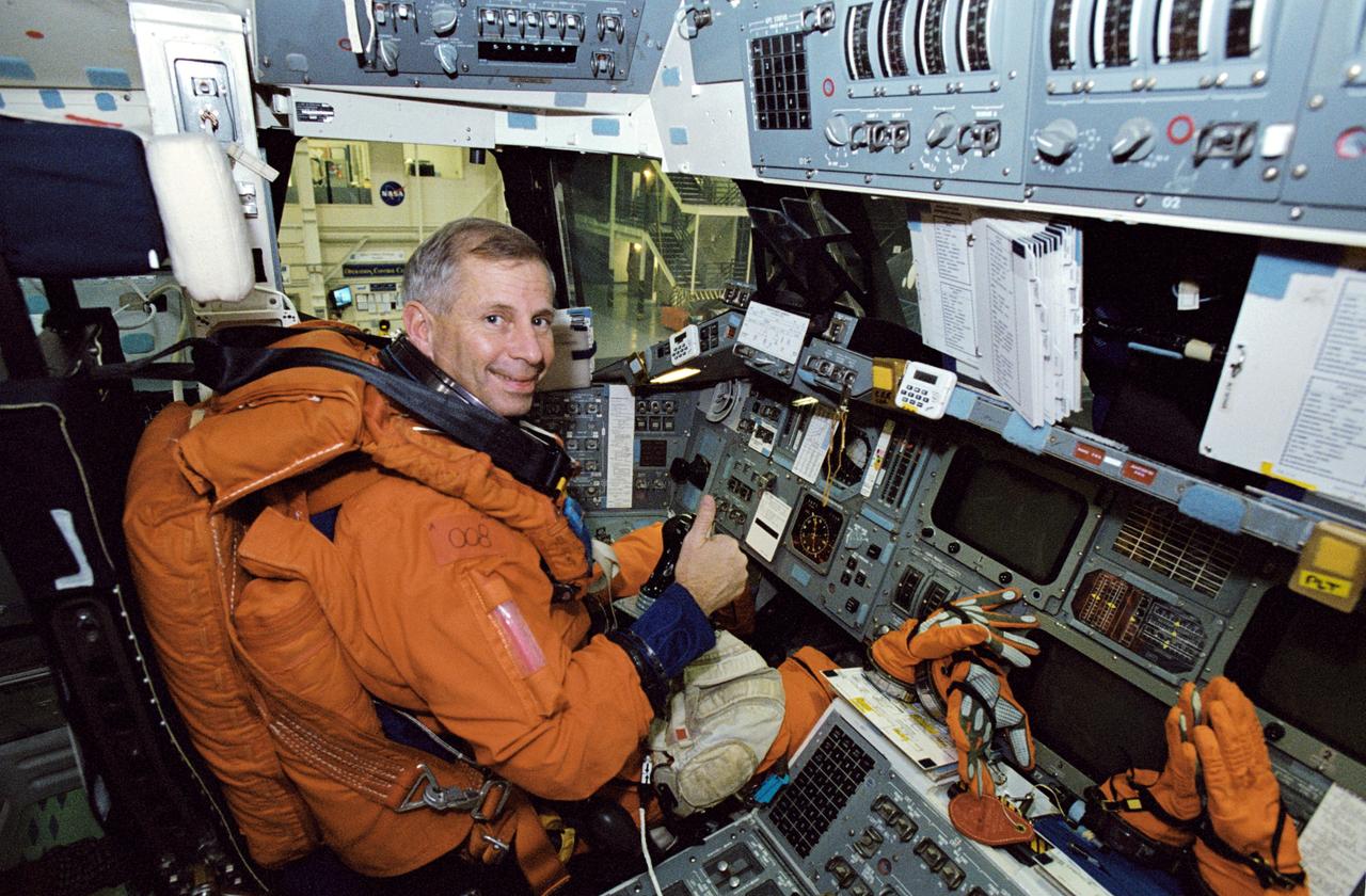 JSC2001-02992 (5 December 2001) --- Astronaut Kenneth D. Cockrell, STS-111 mission commander, occupies the commander’s station during a mission training session in the Space Vehicle Mockup Facility at the Johnson Space Center (JSC). Cockrell is attired in a training version of the shuttle launch and entry garment. STS-111 will be the 14th shuttle mission to visit the International Space Station (ISS).