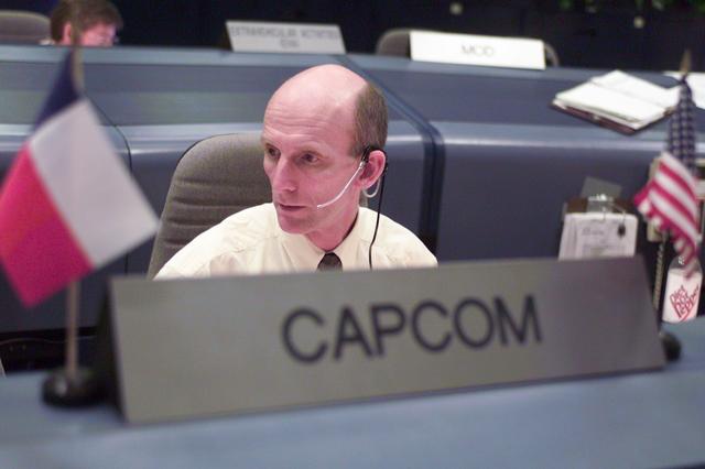 JSC2001-E-04137 (7 February 2001) ---  Astronaut Gerhard P.J. Thiele, representing the European Space Agency,  monitors information from the Kennedy Space Center (KSC) on STS-98 launch day.  Thiele serves as spacecraft communicator (CAPCOM) in the Johnson Space Center's Mission Control Center (MCC).