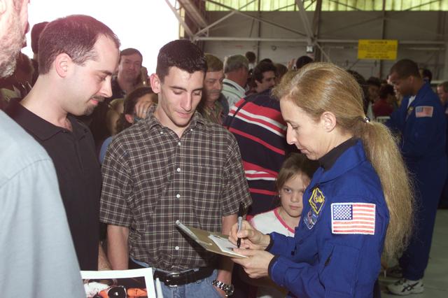 NASA image: Photographic documentation of the return of the STS-98 crew to Ellington Field