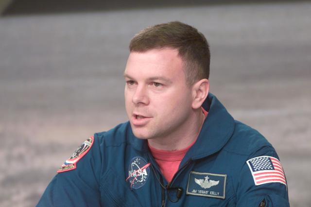 JSC2001-E-05531 (28 February 2001) ---  Astronaut James M. Kelly, STS-102 pilot,  responds to a news media representative's question during a press briefing at the Johnson Space Center (JSC).