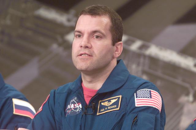 JSC2001-E-05533 (28 February 2001) --- Astronaut Paul W. Richards, STS-102 mission specialist, responds to a news media representative's question during a press briefing at the Johnson Space Center (JSC).