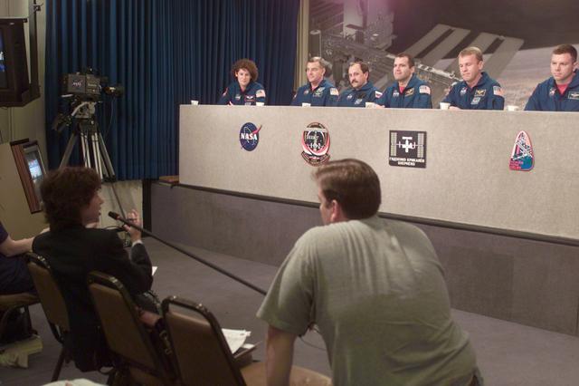 JSC2001-E-05534 (28 February 2001) ---  The STS-102 crew fields questions from various news media representatives at a press briefing at the Johnson Space Center (JSC).  From the right are astronauts James M. Kelly, pilot; and Andrew S.W. Thomas and Paul W. Richards,  both mission specialists; cosmonaut Yury V. Usachev, and astronauts James S. Voss and Susan J. Helms, all mission specialists. Astronaut James D. Wetherbee, STS-102 commander, is out of frame at right.  Expedition Two commander Usachev, representing Rosaviakosmos, will join Voss and Helms in the first crew exchange aboard the Earth-orbiting International Space Station (ISS) at some point following the docking of the outpost and the Space Shuttle Discovery.