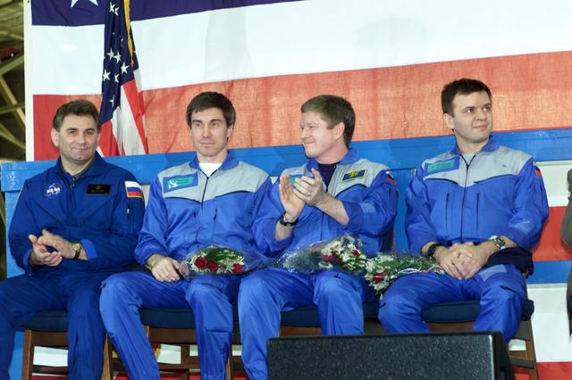JSC2001-E-08325 (22 March 2001) --- Some of the participants of the Expedition One and STS-102 crew return ceremony applaud one of the speakers.  Pictured from the left are cosmonaut Vasily Tsibliev, Deputy Director of the Gagarin Cosmonaut Training Center in Star City; cosmonaut  Sergei K. Krikalev, Expedition One flight engineer; astronaut William M. (Bill) Shepherd, mission commander; and Yuri P. Gidzenko, Soyuz commander.