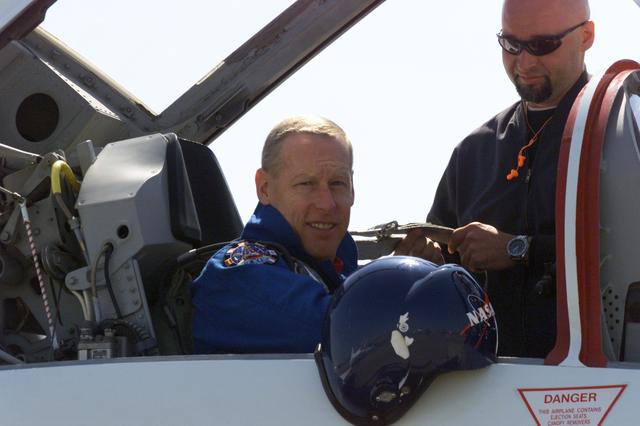 JSC2001-E-08821 (26 March 2001) --- Astronaut Patrick G. Forrester, STS-105 mission specialist, photographed in a T-38 trainer jet, prepares for a flight at Ellington Field near Johnson Space Center (JSC).