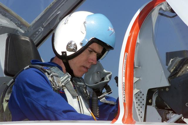 JSC2001-E-08833 (26 March 2001) --- Astronaut Daniel T. Barry, STS-105 mission specialist, photographed in a T-38 trainer jet, prepares for a flight at Ellington Field near Johnson Space Center (JSC).