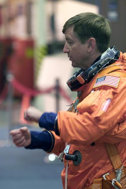 JSC2001-E-12456 (24 April 2001) --- Astronaut Frank L. Culbertson, Jr., Expedition Three mission commander, is photographed wearing a training version of the full-pressure launch and entry suit during a mission training session in the Systems Integration Facility at Johnson Space Center (JSC). The Expedition Three crew is scheduled to launch aboard the Space Shuttle Discovery this summer to begin a lengthy stay onboard the International Space Station (ISS).