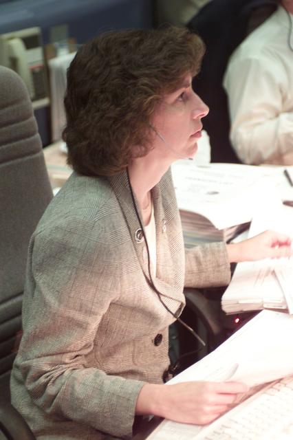 JSC2001-E-12474 (April 2001) --- Astronaut Ellen Ochoa, at the Spacecraft Communicator (CAPCOM) console in the flight control room of Houston's Mission Control Center, watches monitors and displays while communicating with the Space Shuttle Endeavour crew in space.