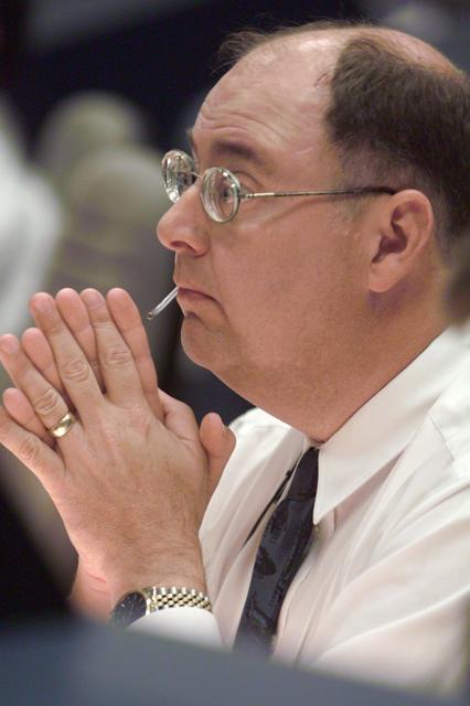 JSC2001-E-21333 (12 July 2001) --- From a familiar setting in the shuttle flight control room (WFCR) at Houston's Mission Control Center (MCC), Wayne Hale, ascent flight director for STS-104, pays close attention to new data related to the Space Shuttle Atlantis and its impending launch from the Kennedy Space Center (KSC) in Florida.