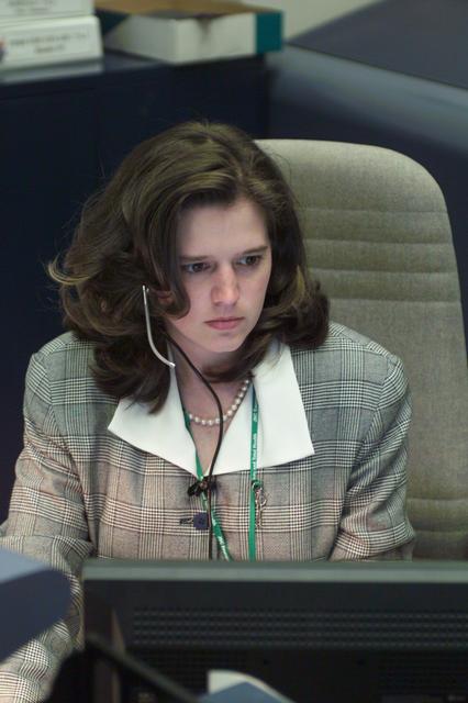 JSC2001-E-21558 (13 July 2001) --- Angela Prince looks over some STS-104 data at her console in the shuttle flight control room (WFCR) of Houston's Mission Control Center (MCC).
