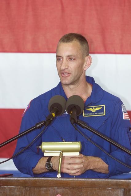 JSC2001-E-22795 (25 July 2001) --- Astronaut Charles O. Hobaugh, STS-104 pilot, addresses a crowd at Ellington Field&#0146;s Hangar 990 for a crew return ceremony.