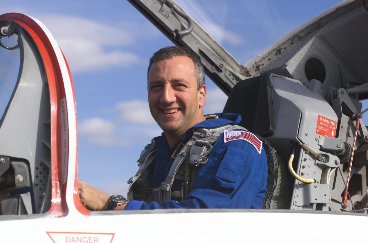 JSC2002-E-01740 (16 January 2002) --- Astronaut Michael J. Massimino, STS-109 mission specialist, photographed in a T-38 trainer jet, prepares for a flight at Ellington Field near Johnson Space Center (JSC).