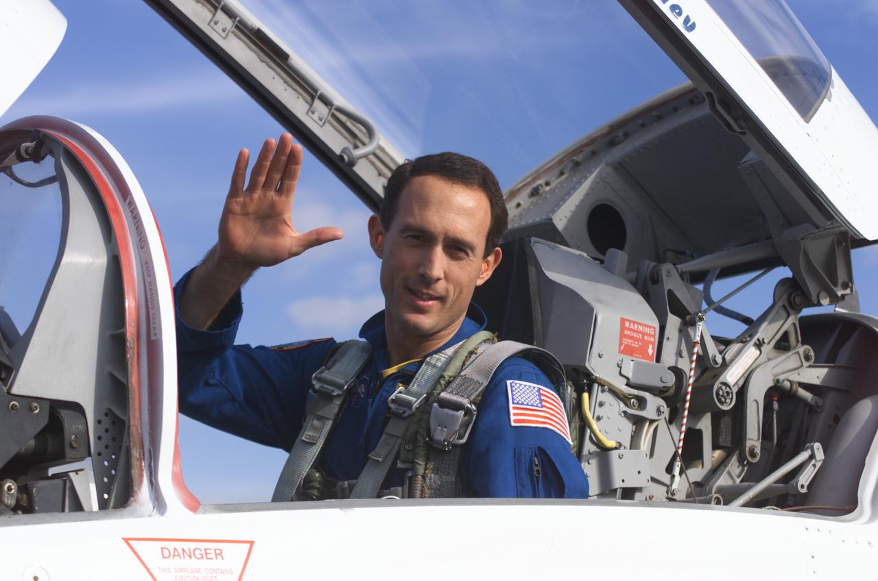 JSC2002-E-01741 (16 January 2002) --- Astronaut James H. Newman, STS-109 mission specialist, photographed in a T-38 trainer jet, prepares for a flight at Ellington Field near Johnson Space Center (JSC).