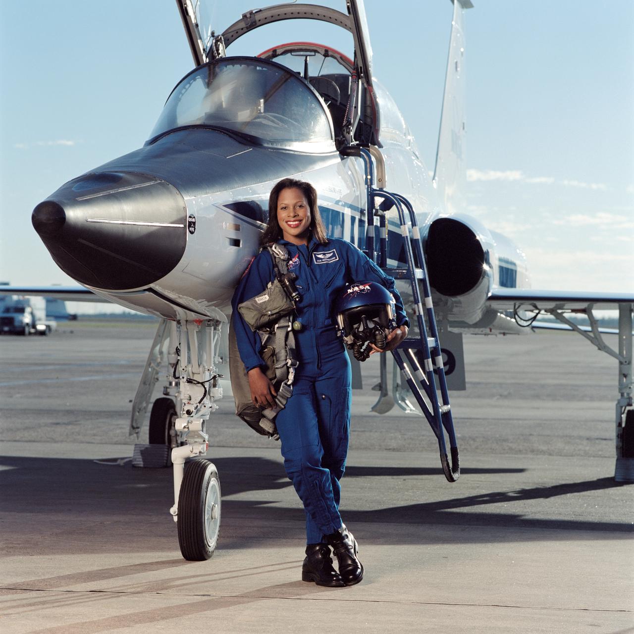 JSC2003-00678 (January 2003) --- Astronaut Joan E. Higginbotham, STS-116 mission specialist, takes a break from training to pose for a portrait with a NASA T-38 trainer jet at Ellington Field near Johnson Space Center.