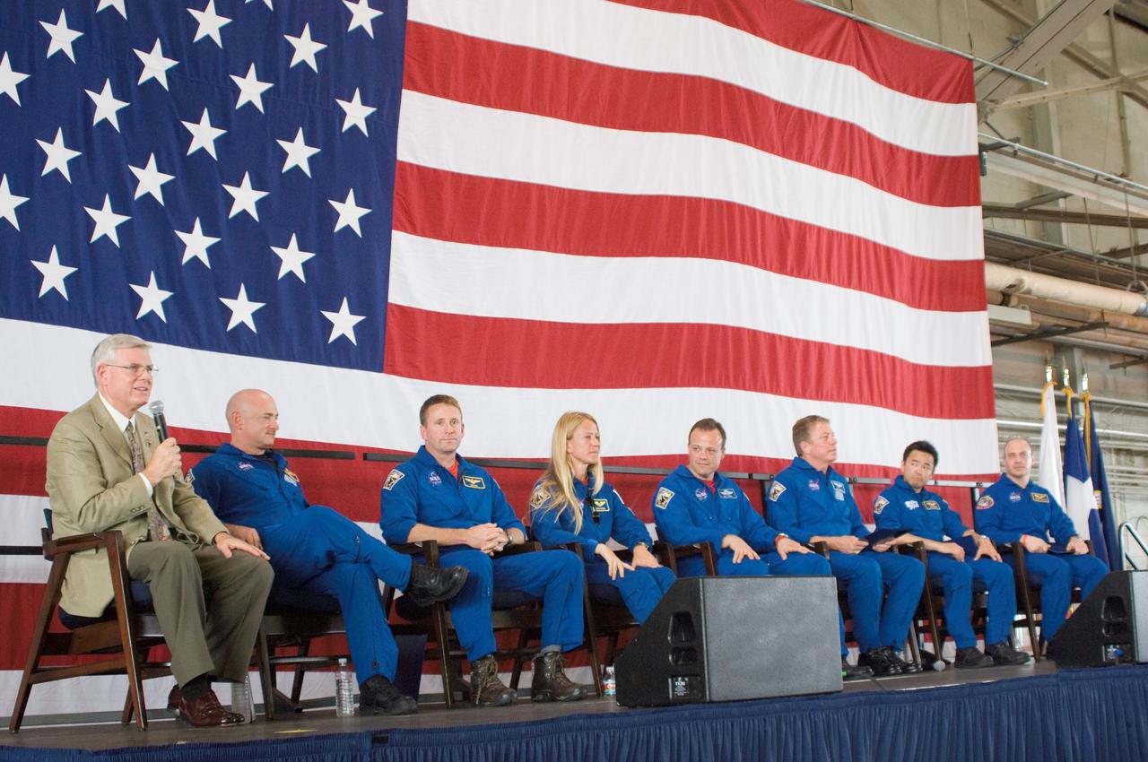 JSC2008-E-047157 (15 June 2008) --- NASA's Johnson Space Center (JSC) director Michael L. Coats (far left) addresses a large crowd of well-wishers at the STS-124 crew return ceremony on June 15, 2008 at Ellington Field near JSC. From the second left are NASA astronauts Mark Kelly, commander; Ken Ham, pilot; Karen Nyberg, Ron Garan, Mike Fossum, Japan Aerospace Exploration Agency astronaut Akihiko Hoshide and NASA astronaut Garrett Reisman, all mission specialists.