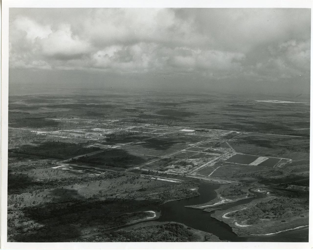 CAPE CANAVERAL, Fla. -- This aerial of view from 1963 shows the site of the Industrial Area for the Merritt Island Launch Annex, now the Kennedy Space Center in Florida. Located five miles south of Launch Complex 39, this is the site where facilities were built such as the Headquarters Building, Operations and Checkout Building as well as the Central Instrumentation Facility. Photo Credit: NASA