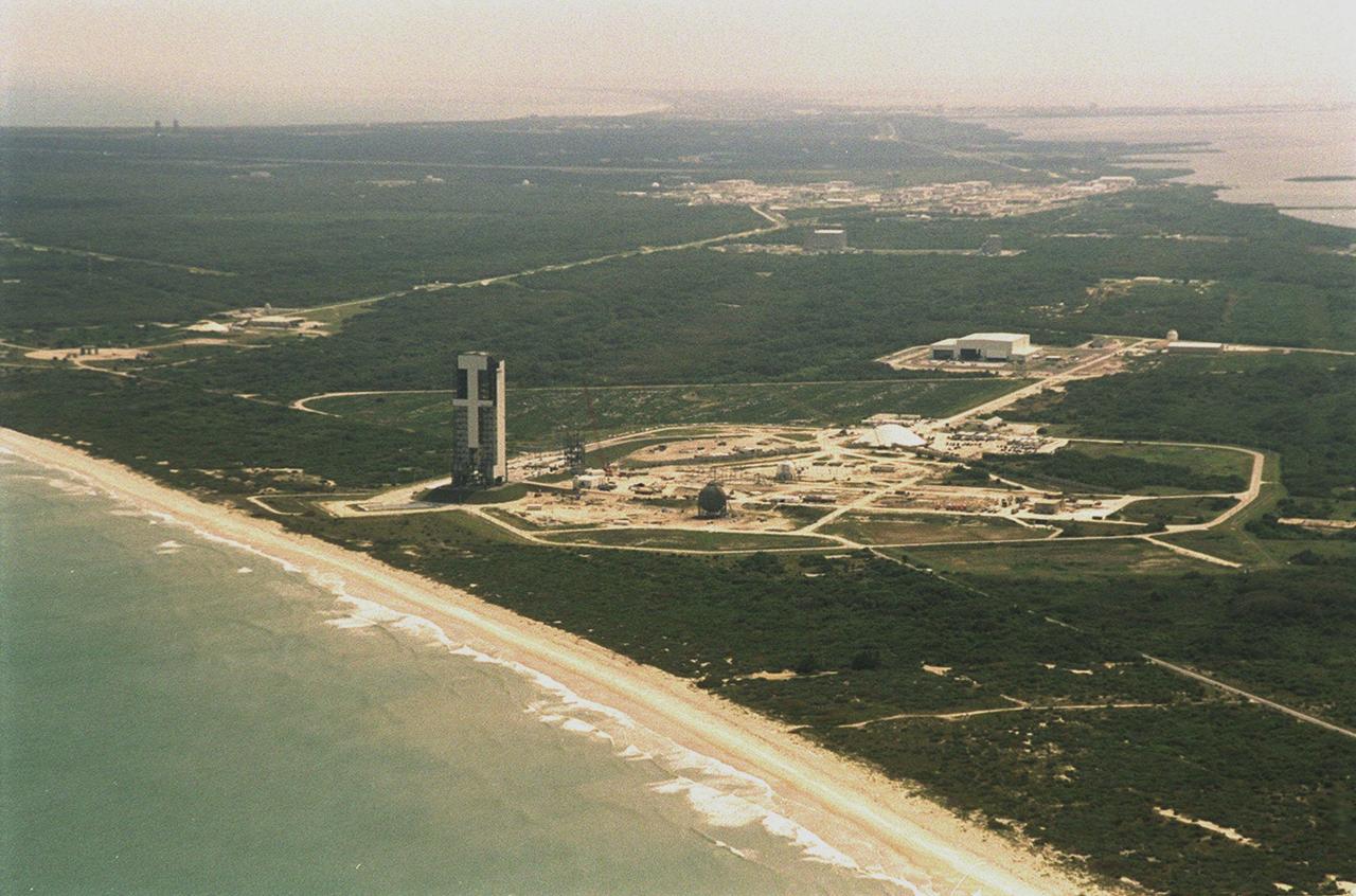 Looking from the east, over the Atlantic Ocean, this aerial view shows the construction on Launch Complex 41, Cape Canaveral Air Force Station, previously used to launch 17 Titan III and 10 Titan IV rockets. Lockheed Martin Astronautics razed the old towers that supported their last Titan launch in April 1999 to make way for construction of this new Atlas V launch facility. The launch pad abuts the Atlantic Ocean on the east, seen here in the foreground. 