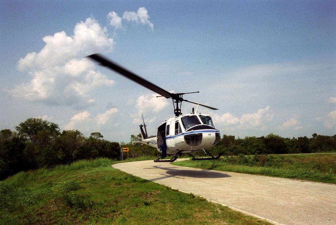 KENNEDY SPACE CENTER, FLA. -   A NASA helicopter lifts off from KSC after returning photographers from an excursion to take pictures of various buildings and structures on the Center.