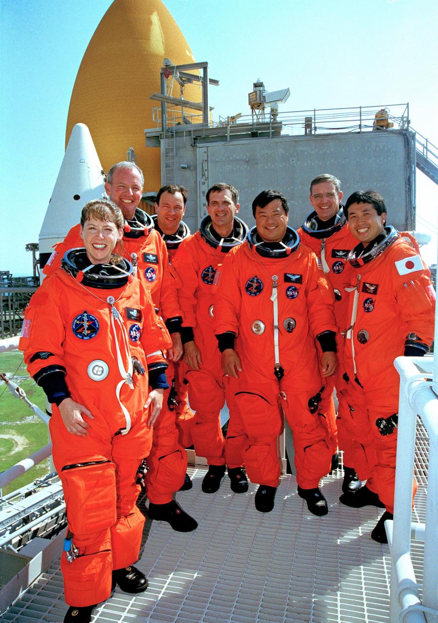 CAPE CANAVERAL, Fla. -- After completing emergency egress training at Launch Pad 39A, the STS-92 crew poses for a photo. Standing, left to right, are Pilot Pamela Ann Melroy, Commander Brian Duffy and Mission Specialists Michael Lopez-Alegria, Peter J.K. “Jeff” Wisoff, Leroy Chiao, William S. McArthur Jr. and Koichi Wakata of Japan. The training is part of Terminal Countdown Demonstration Test activities that also include a simulated countdown. STS-92 is scheduled to launch Oct. 5 at 9:38 p.m. EDT on the fifth flight to the International Space Station. It will carry two elements of the space station, the Integrated Truss Structure Z1 and the third Pressurized Mating Adapter. The mission is also the 100th flight in the Shuttle program.  Photo credit: NASA
